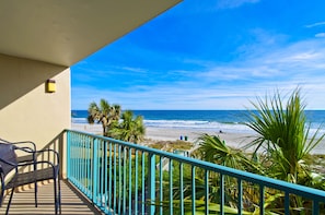 A balcony with a view of the beach and ocean. - Oceanfront Condo on The Golden Mile in Myrtle Beach (Myrtle Beach)