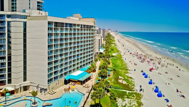 A hotel with a pool, beach access, and a view of the ocean. - Oceanfront Condo on The Golden Mile in Myrtle Beach (Myrtle Beach)