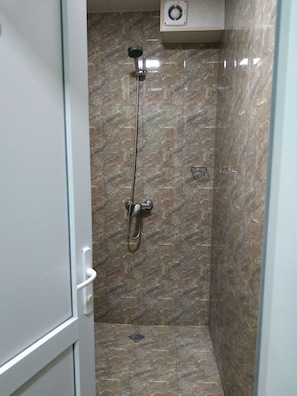 Shower, hair dryer, slippers, towels