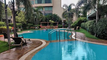 Outdoor pool, open 6:00 AM to 7:00 AM, pool loungers