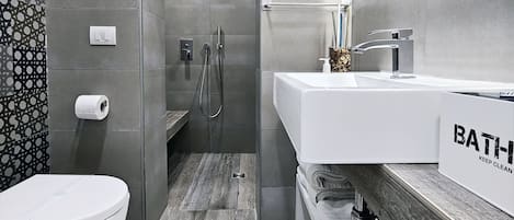 Shower, eco-friendly toiletries, hair dryer, bidet