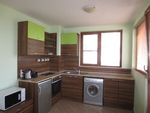 Family Apartment | Private kitchen | Fridge, microwave, stovetop, electric kettle - Fantasy Apartments (Varna)