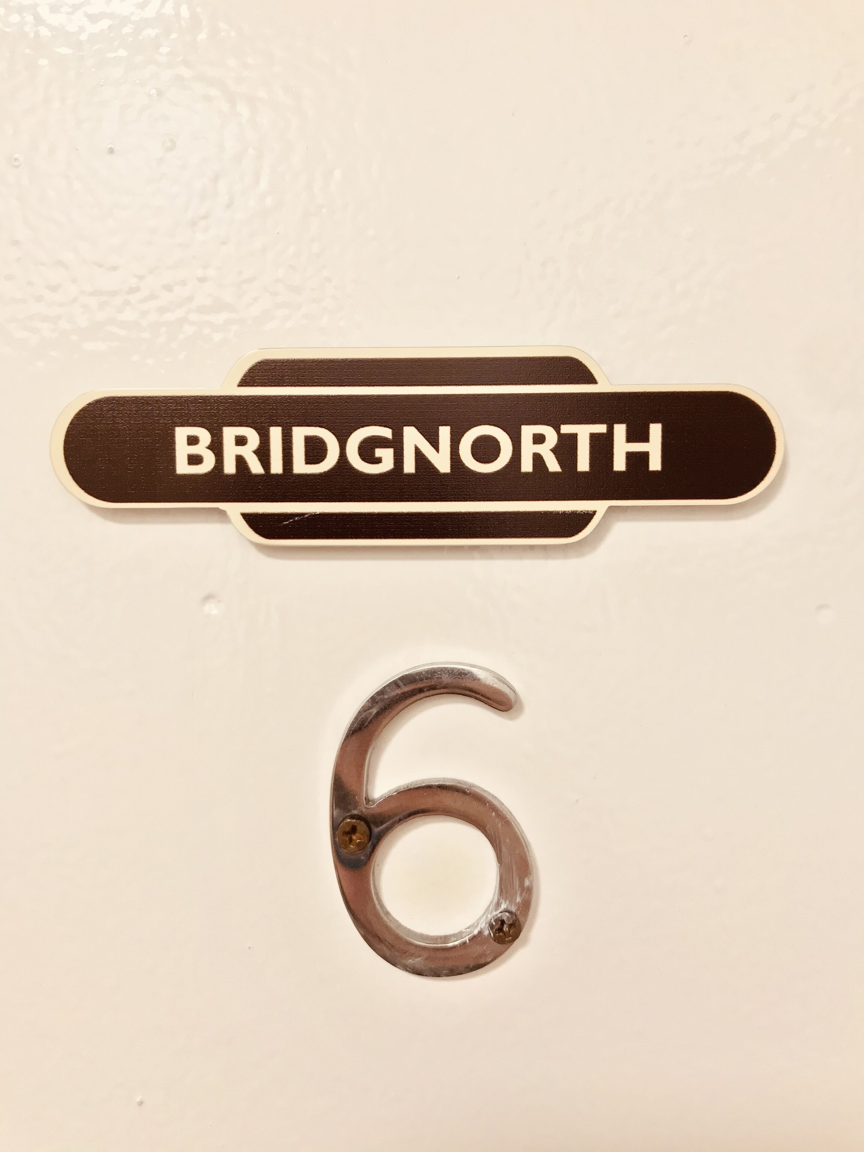 A sign with the name 'BRIDG'NORTH' and the number '6'.