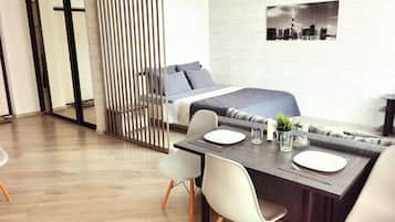 Standard Apartment | Living area | 35-inch flat-screen TV with cable channels, TV