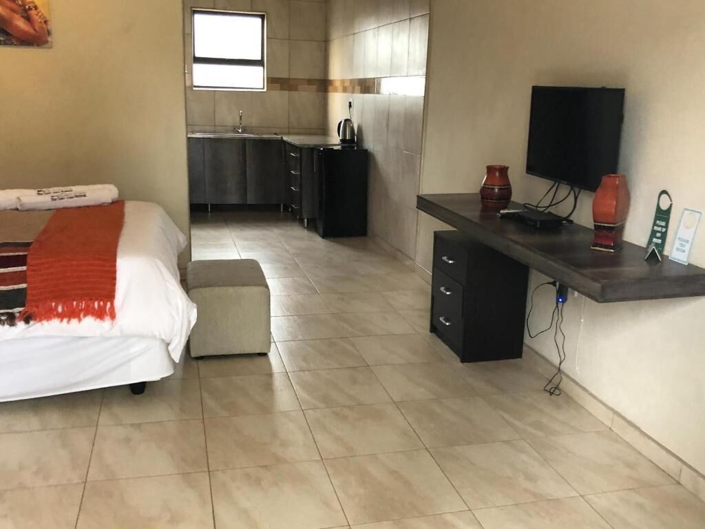 Individually furnished, desk, laptop workspace, iron/ironing board