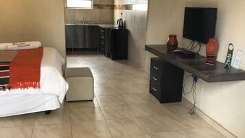 Individually furnished, desk, laptop workspace, iron/ironing board