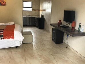Individually furnished, desk, laptop workspace, iron/ironing board