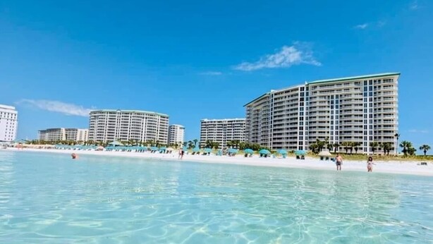 A beachfront hotel with multiple high-rise buildings, clear blue water, and a sandy beach. - Newly Renovated Gulf Front Gorgeous Views in St. Maarten from the 10th floor!  (Destin)