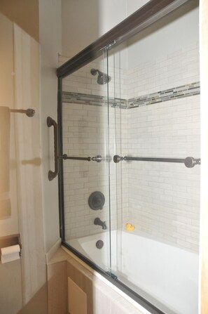 Combined shower/tub, hair dryer, towels, toilet paper