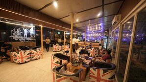 A restaurant with a British theme, featuring Union Jack designs on furniture and decor. - D'Polo Club And Spa Resort, Dharamshala (Dharamshala)