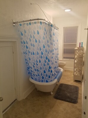 Combined shower/tub, hair dryer, towels, soap