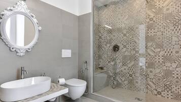 Bathtub, hair dryer, bidet, towels