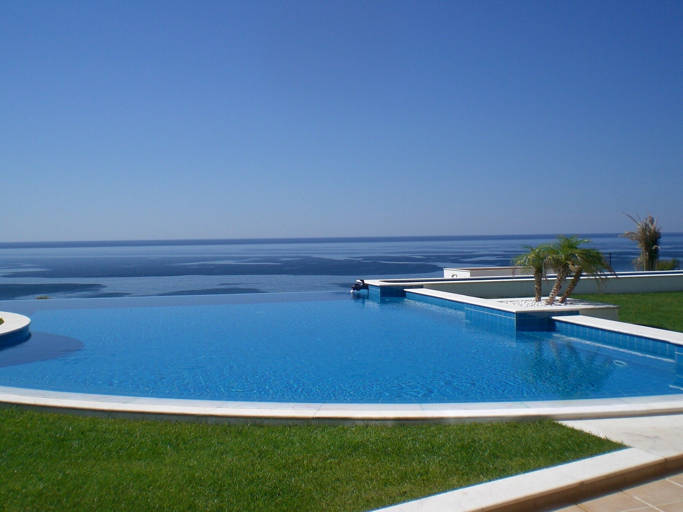 A infinity pool with a view of the ocean.