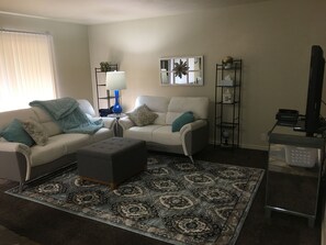 Premium Condo, 1 Bedroom, Kitchen (Unit E8) | Living room | Flat-screen TV, pay films