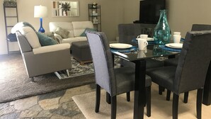 Premium Condo, 1 Bedroom, Kitchen (Unit E8) | Living area | Flat-screen TV, pay films - Parkway Suites (West Valley City)
