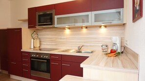 Een koelkast, een oven, een vaatwasser