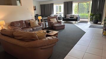 Family House, Multiple Bedrooms | Living area | 50-inch LED TV with digital channels, TV