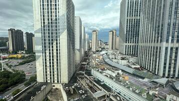 A high-rise urban area with modern architecture, including tall buildings and a complex network of roads and infrastructure.