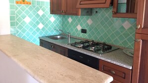 Villa, 2 Bedrooms | Private kitchen | Fridge, stovetop, cookware/dishes/utensils - Porto San Paolo Villino II (Loiri Porto San Paolo)