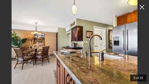 Enjoy meals in the spacious kitchen with a central island and dining area.