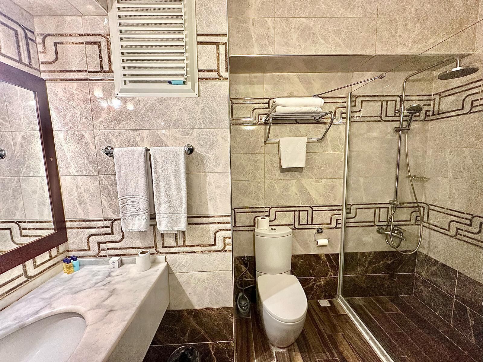 Shower, free toiletries, hair dryer, slippers