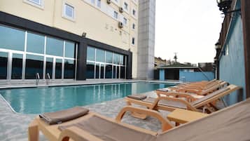 Outdoor pool, pool umbrellas, sun loungers