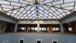 A spacious atrium with a high ceiling and a geometric glass roof structure. - Saylamlar Hotel (Trabzon)