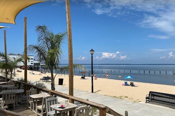 Beach nearby, white sand, beach umbrellas, beach towels