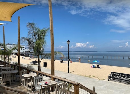 Beach nearby, white sand, beach umbrellas, beach towels