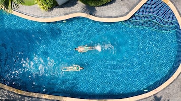 Outdoor pool, open 7:00 AM to 9:00 PM, pool loungers