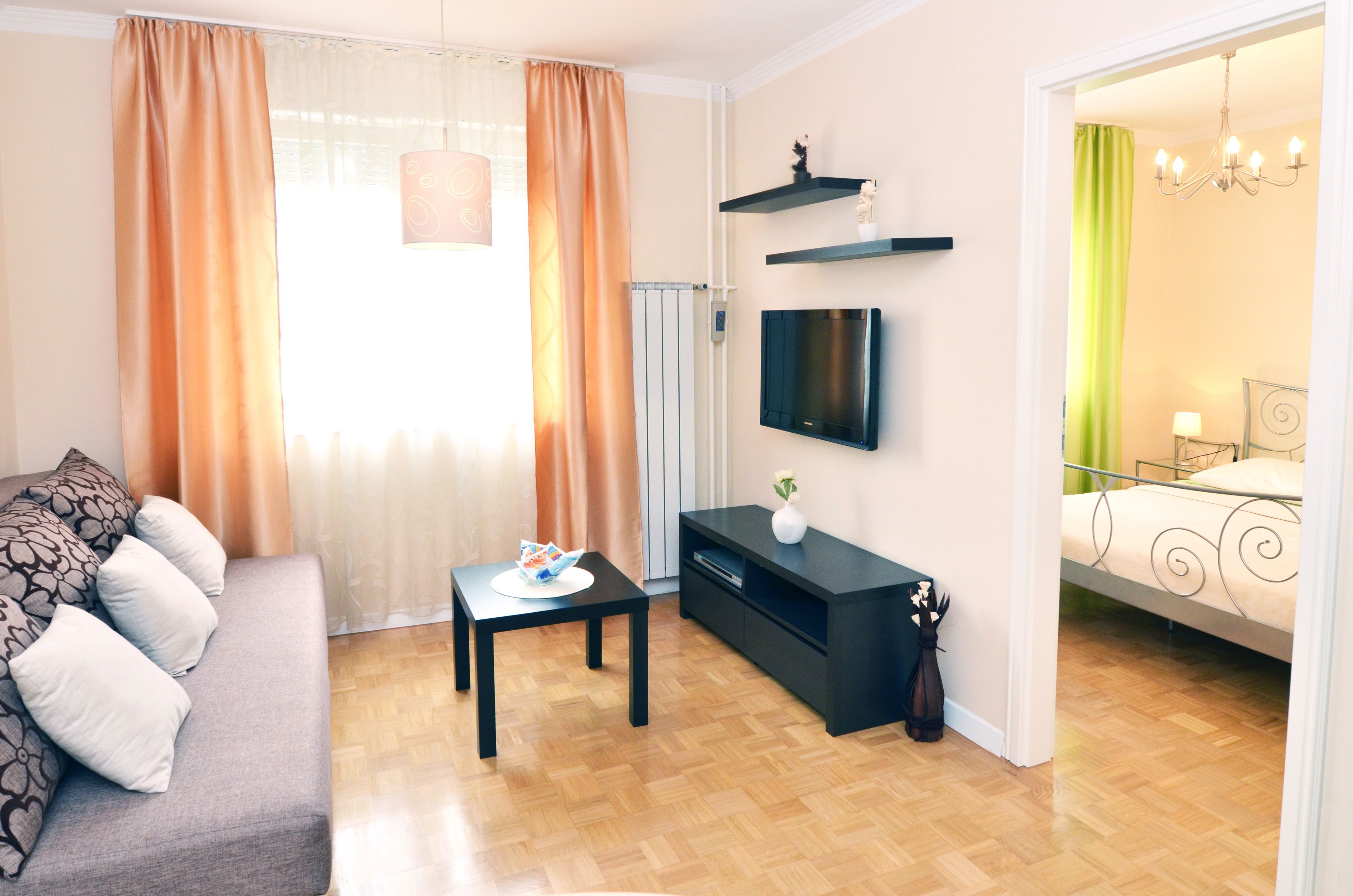 Apartment, City View | Living area | Flat-screen TV