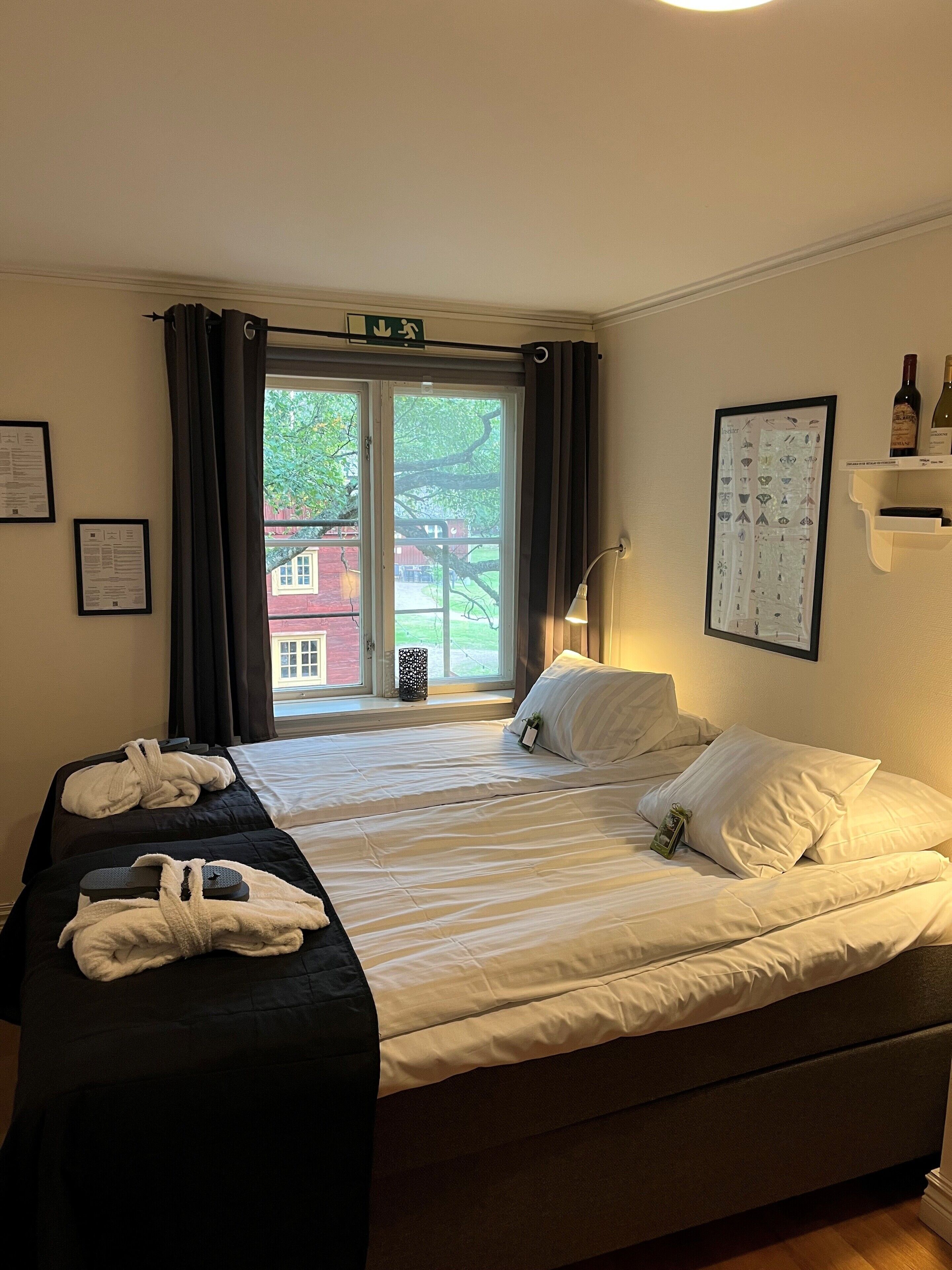 quadruple room, private bathroom (4 single beds, hotel) | minibar, blackout curtains, iron/ironing board, free wifi