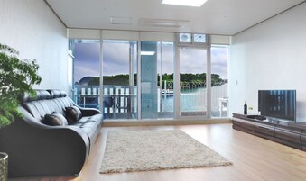 Superior Apartment, Ocean View | Living area | 42-inch flat-screen TV with cable channels, TV, heated floors