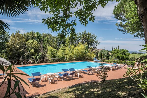 Seasonal outdoor pool, open 8:30 AM to 8:00 PM, pool umbrellas