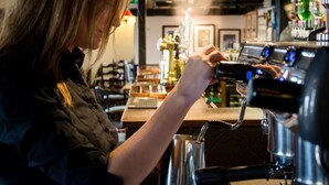 A barista at work, preparing a drink with a coffee machine. - The Barrel Inn (Hope Valley)