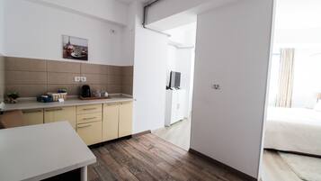 Deluxe Room | Living area | Flat-screen TV