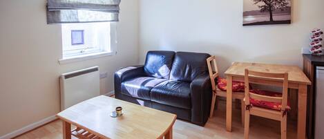Apartment, 1 Bedroom | Living area | Flat-screen TV