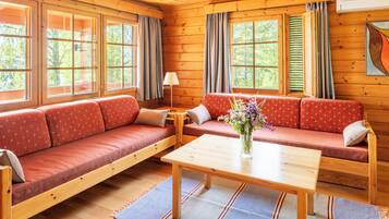 Traditional Bungalow, 2 Bedrooms, Partial Lake View | Living area | 100-cm flat-screen TV with satellite channels, TV, fireplace