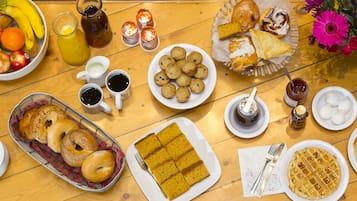 A breakfast buffet with various food items and beverages.