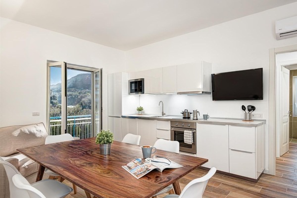 Apartment, 3 Bedrooms | Private kitchen | Full-size fridge, stovetop, cookware/dishes/utensils