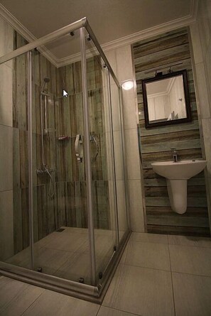 Shower, free toiletries, hair dryer, slippers