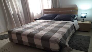 2 bedrooms, blackout drapes, iron/ironing board, free rollaway beds