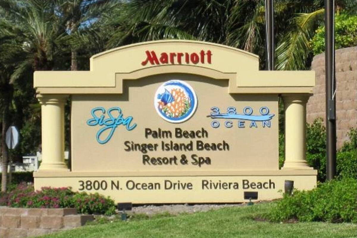 A sign for the Marriott Palm Beach Singer Island Beach Resort & Spa, including the address 3800 N. Ocean Drive, Riviera Beach.