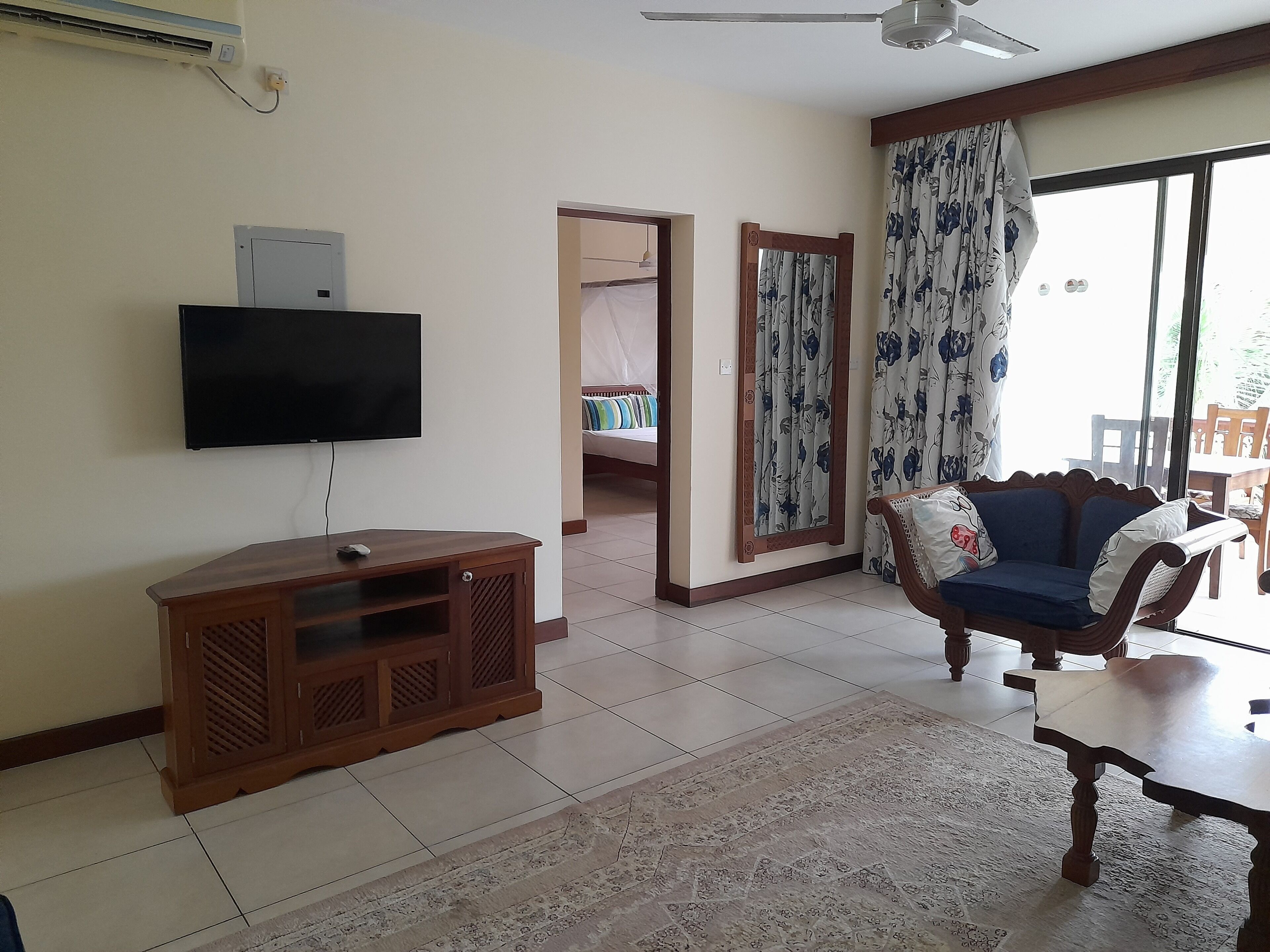 Family Apartment, Pool View | Living area | Flat-screen TV, pay movies
