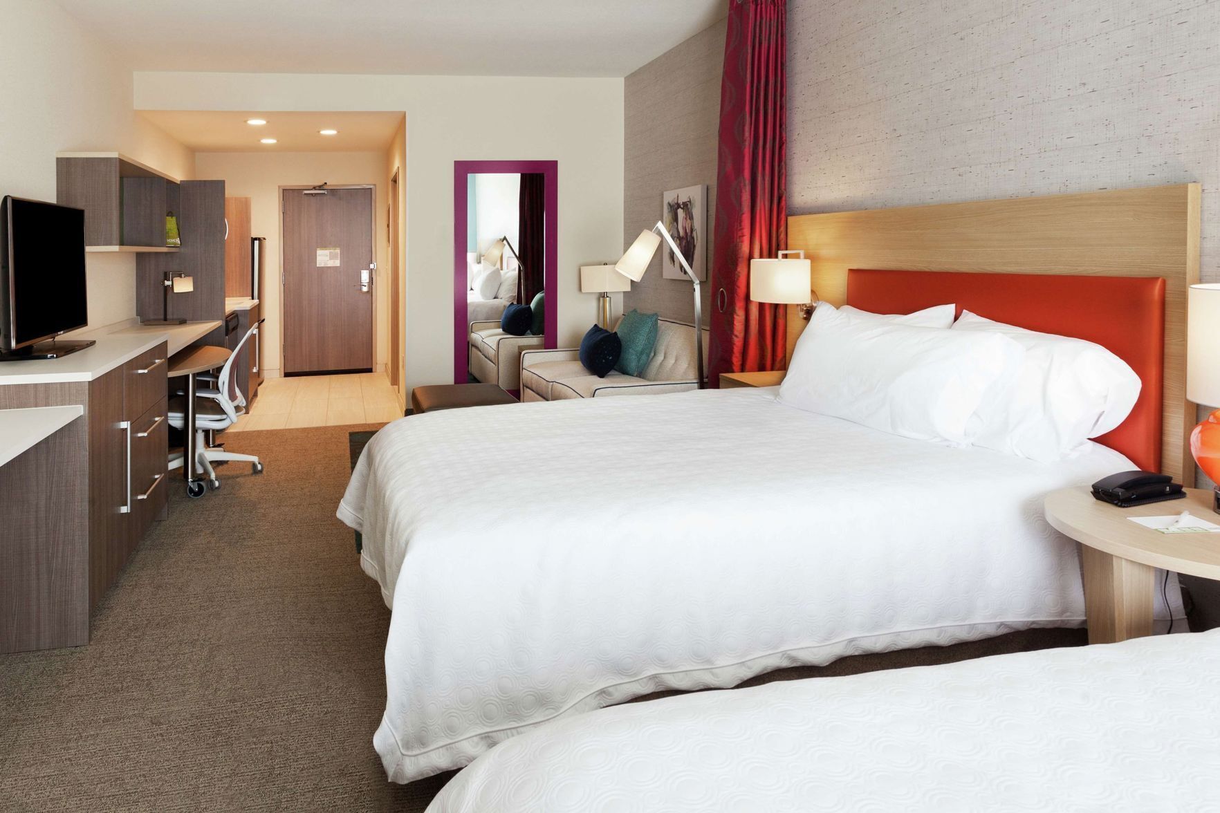 Premium bedding, desk, laptop workspace, blackout drapes