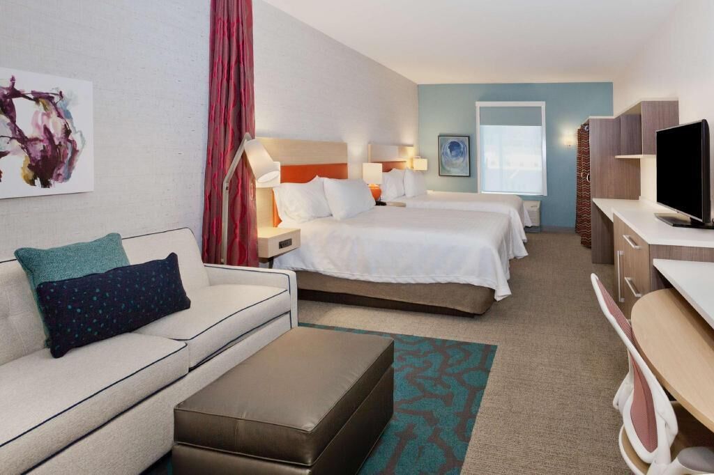 Premium bedding, desk, laptop workspace, blackout drapes