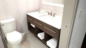 A compact bathroom with a toilet, sink, and vanity.
