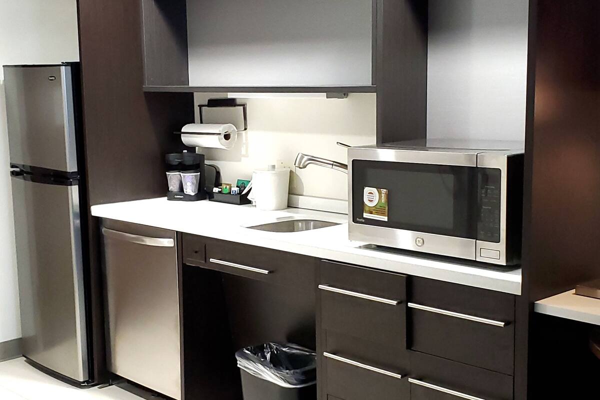 full-sized fridge, microwave, dishwasher, coffee/tea maker