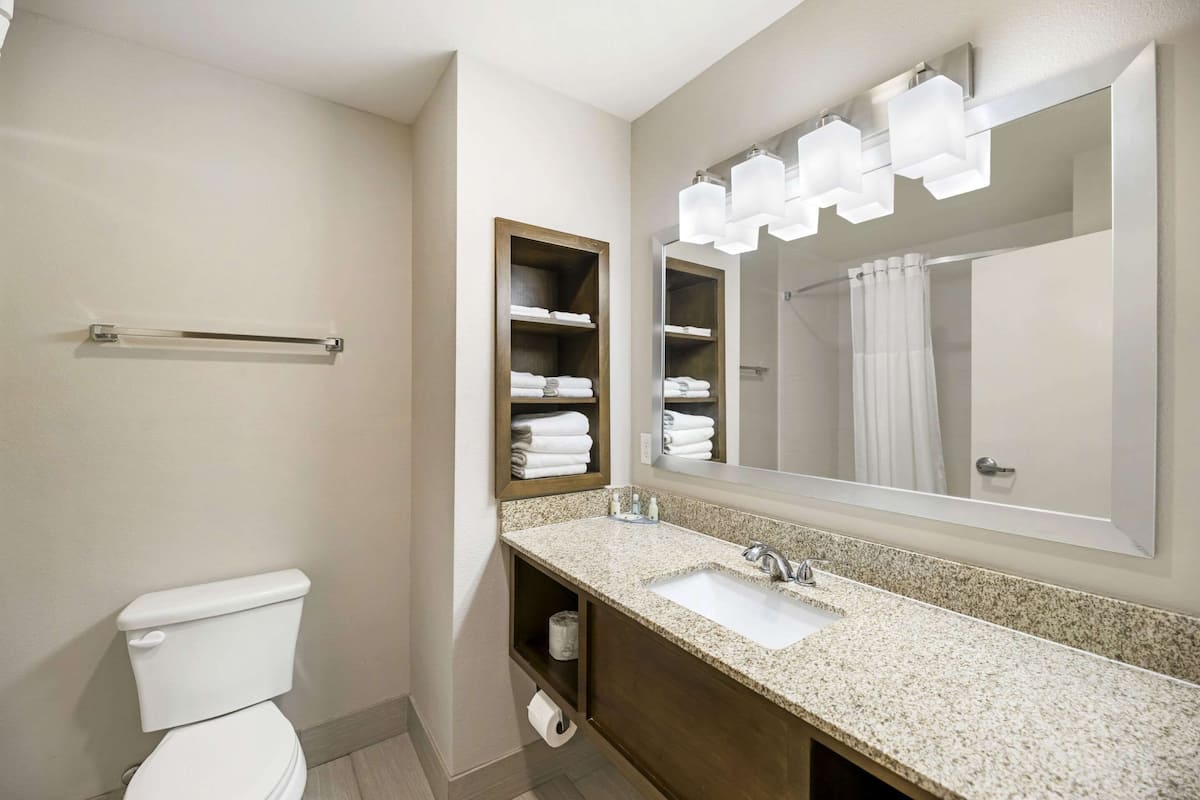 premium bedding, desk, laptop workspace, blackout curtains