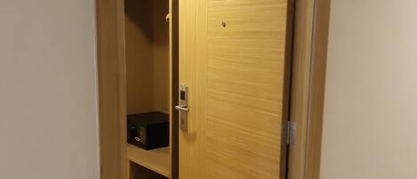 A wooden door with a number plate '204' indicating room number.